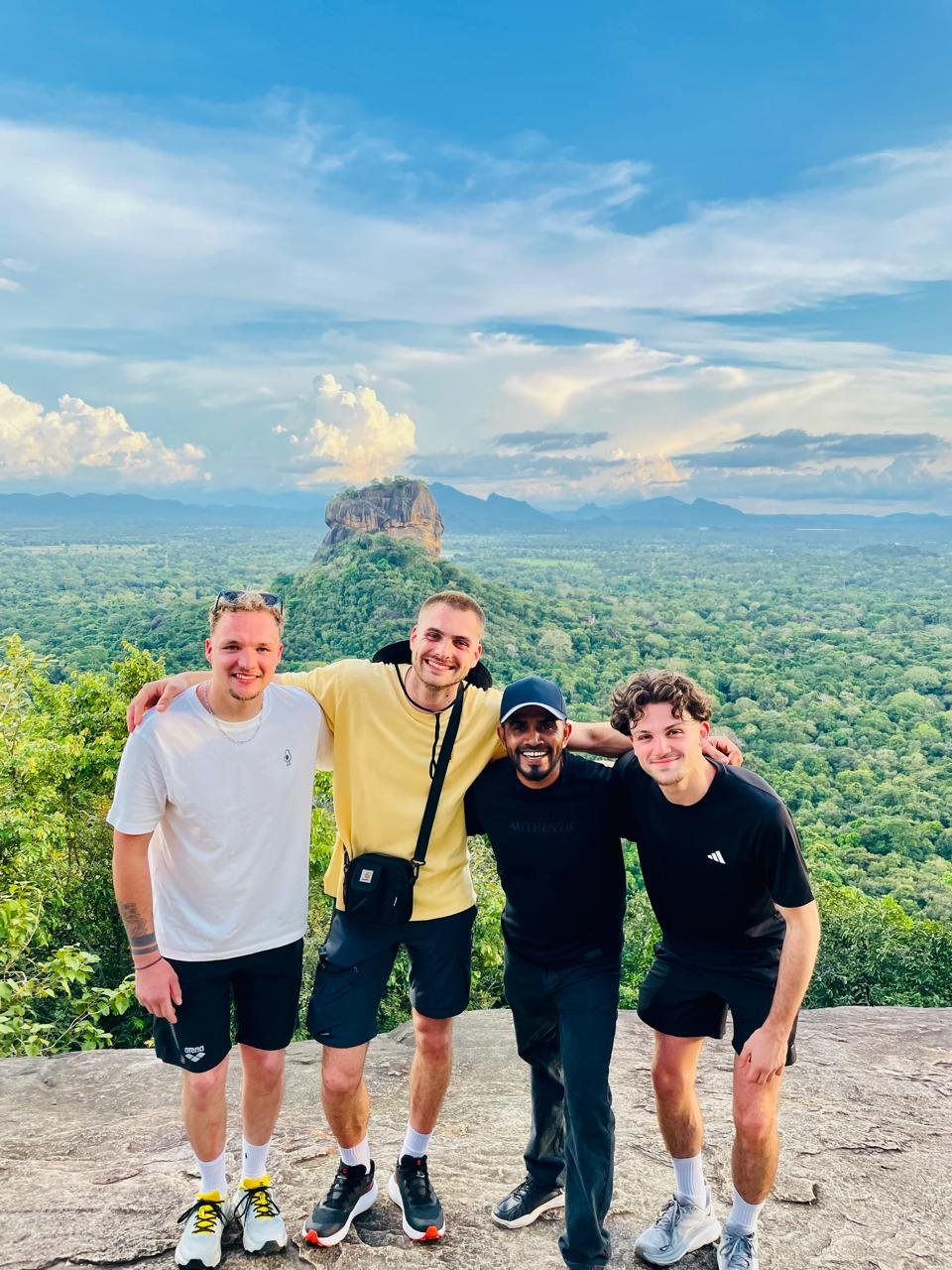 Sri Aurora Lanka guide with travellers overlooking Sigiriya